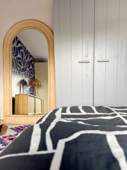 Rattan floor mirror